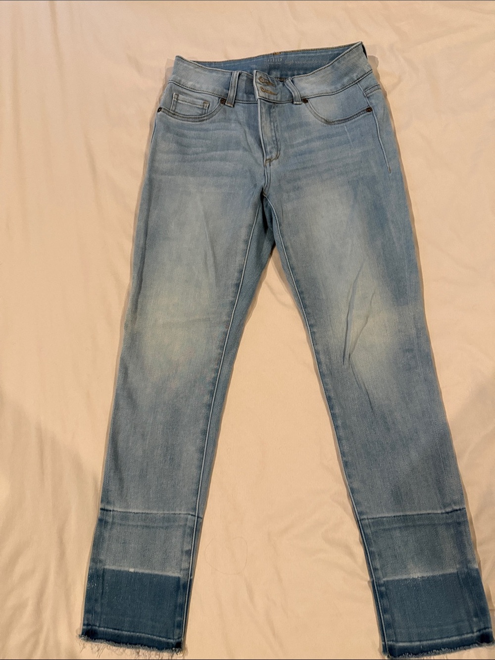New York & Company Light Blue Skinny Jeans with Raw Hem